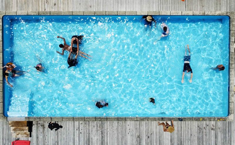 Aerial view of people enjoying the swimming pool